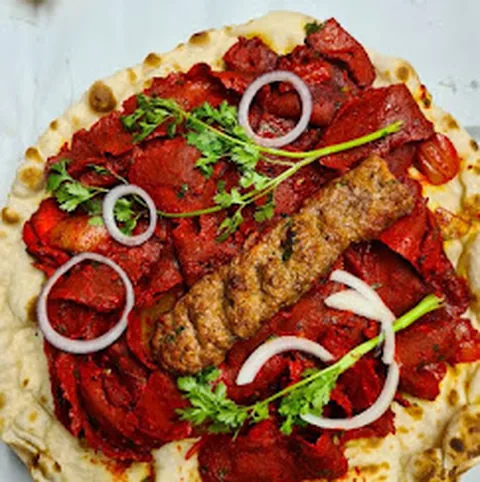 Seekh kebab and tikka on naan